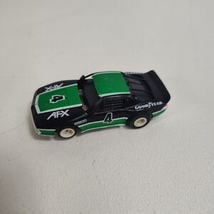 AFX / Tomy CAMARO Black/Green/White #4 HO Slot Car 3r Generation F Body